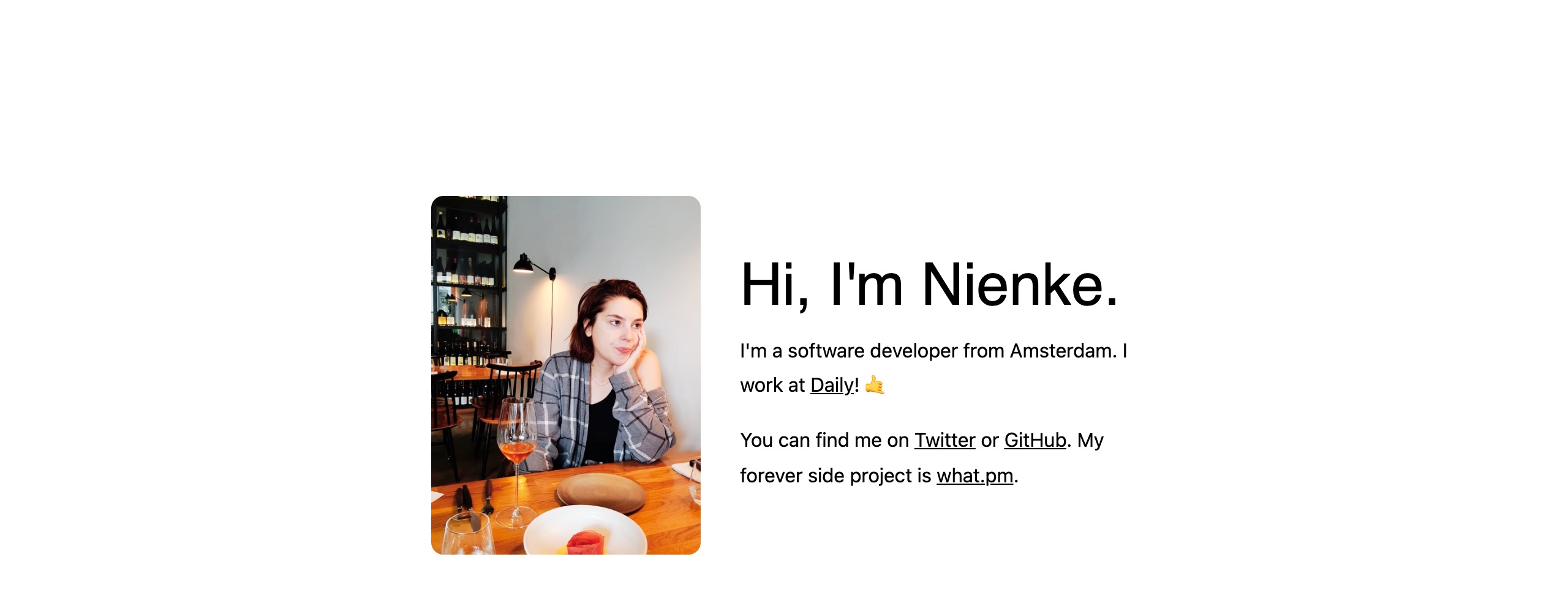A white page with a photo of Nienke at a restaurant table next to the heading Hi, I'm Nienke. and a short introduction